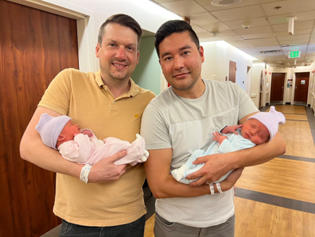 Chris (left) and Bryan (right) with their twins, Brecon and London