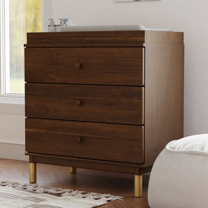 M12923NLGLD,Babyletto,Gelato 3-Drawer Changer Dresser Gold Feet w/Removable Changing Tray in Natural Walnut