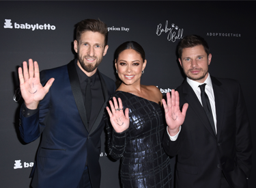 image of AdoptTogether CEO and founder Hank Fortener and Vanessa and Nick Lachey at the AdoptTogther 3rd Annual Baby Ball Gala 10-21-17