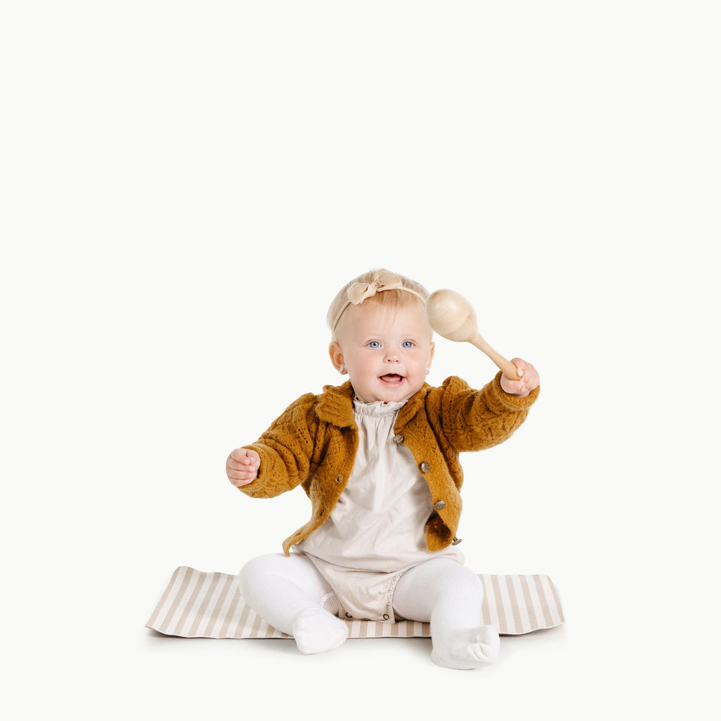 Image of a baby in a padded mat