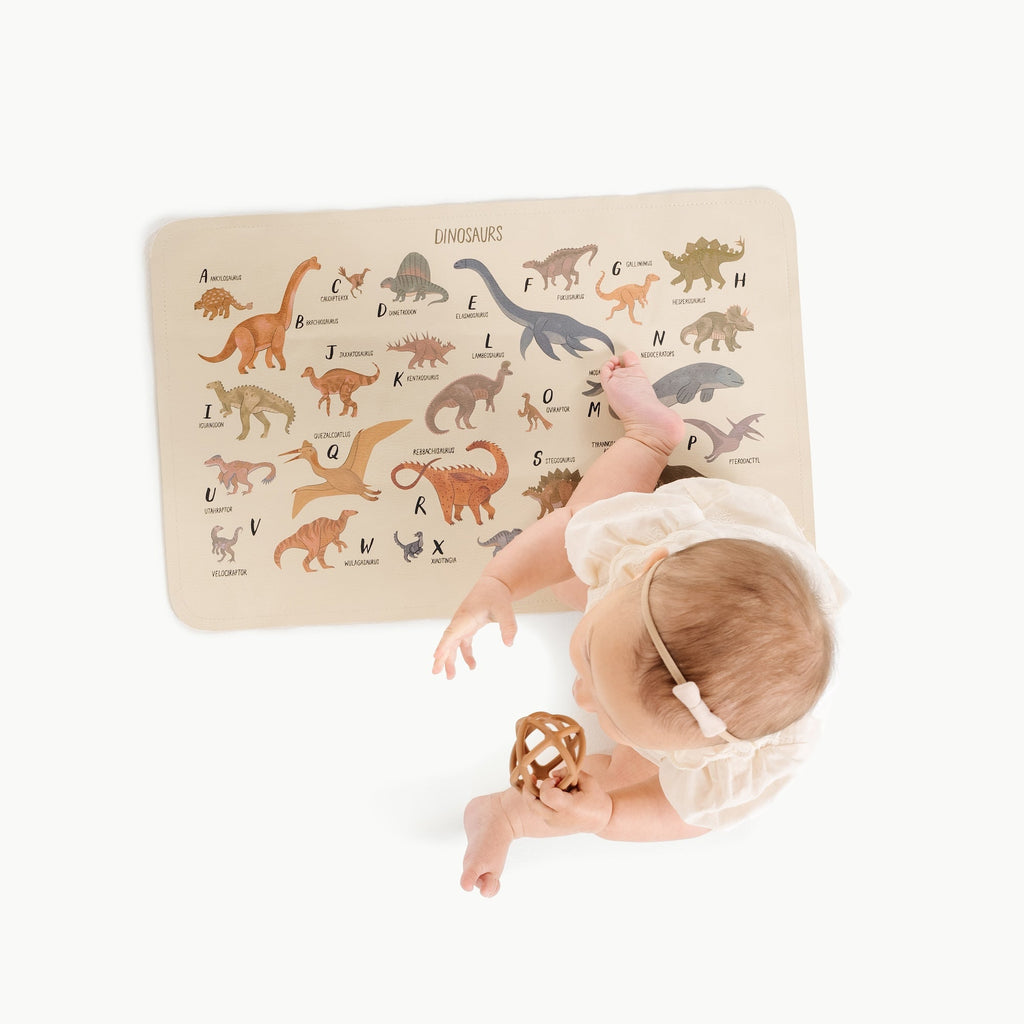 Image of a baby in a padded mat