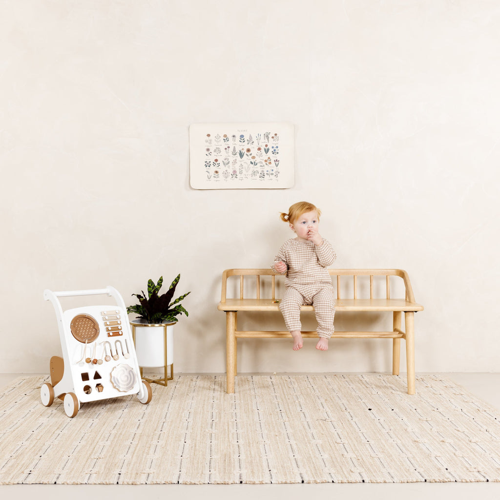 image of a baby sitting on a bench