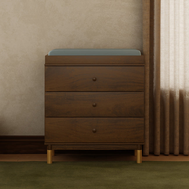 M12923NLGLD,Babyletto,Gelato 3-Drawer Changer Dresser  Gold Feet w/Removable Changing Tray in Natural Walnut