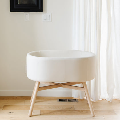 M26834GYLB,Babyletto,babyletto x GATHRE Capsule Bassinet in Ivory
