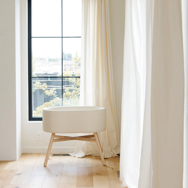M26834GYLB,Babyletto,babyletto x GATHRE Capsule Bassinet in Ivory
