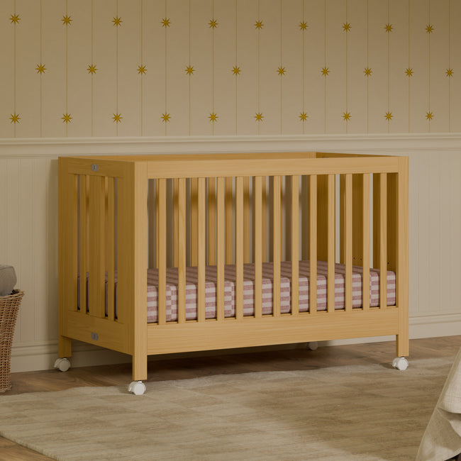 M6601HY,Babyletto,Maki Full-Size Folding Crib w/ Toddler Bed Conversion Kit in Honey
