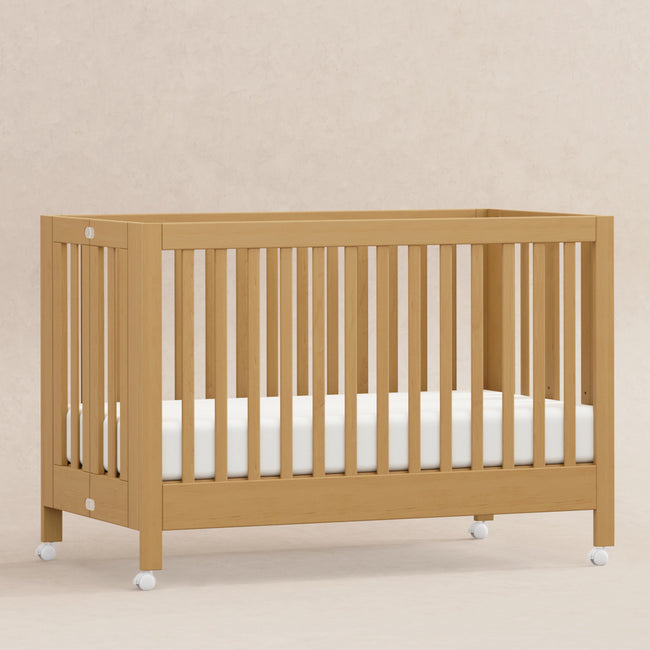 M6601HY,Babyletto,Maki Full-Size Folding Crib w/ Toddler Bed Conversion Kit in Honey