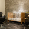 NW26101CKBU,Nursery Works,Altair Crib in Clear Acrylic with Burl