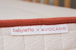 Image of Babyletto x Avocado Crib Brand Tag