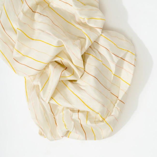 T33635IWS,Babyletto,Wonky Stripe Organic Brushed Cotton Crib Sheet in Ivory with Warm Multi-Color Stripes