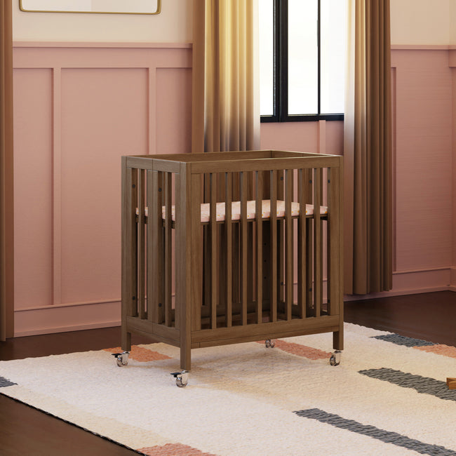 M30880NL,Babyletto,Rolli 9-in-1 Convertible All-Stages® Crib w/ Bassinet & Toddler Bed Kits in Natural Walnut