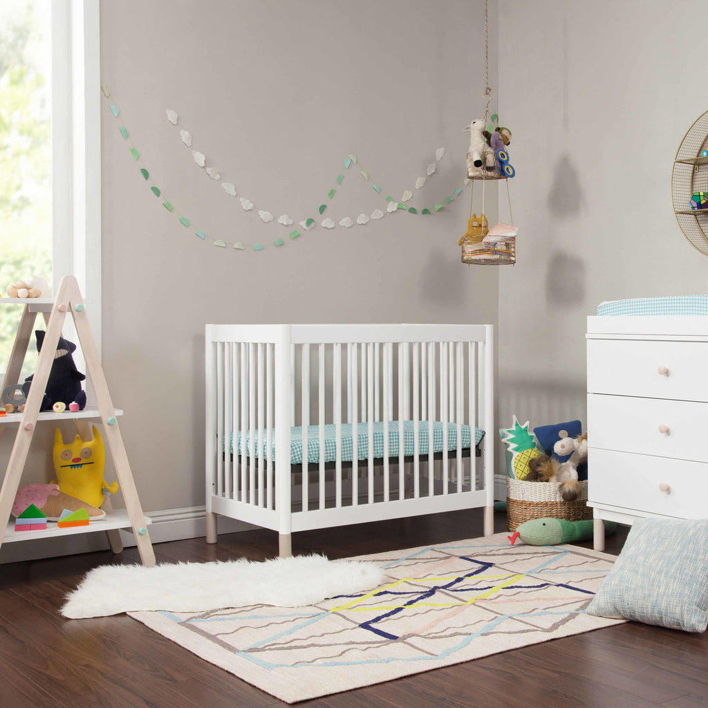 Baby in mini crib online