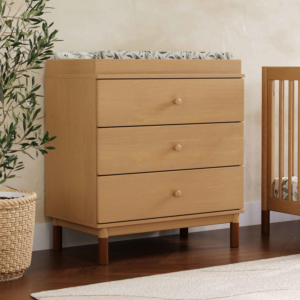 M12923HYVTL,Babyletto,Gelato 3-Drawer Changer Dresser  leather feet w/Removable Changing Tray in Honey