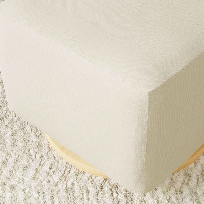 M26385PCMEWLB,Babyletto,Kiwi Gliding Ottoman in Performance Cream Eco-Weave w/ Light Wood Base