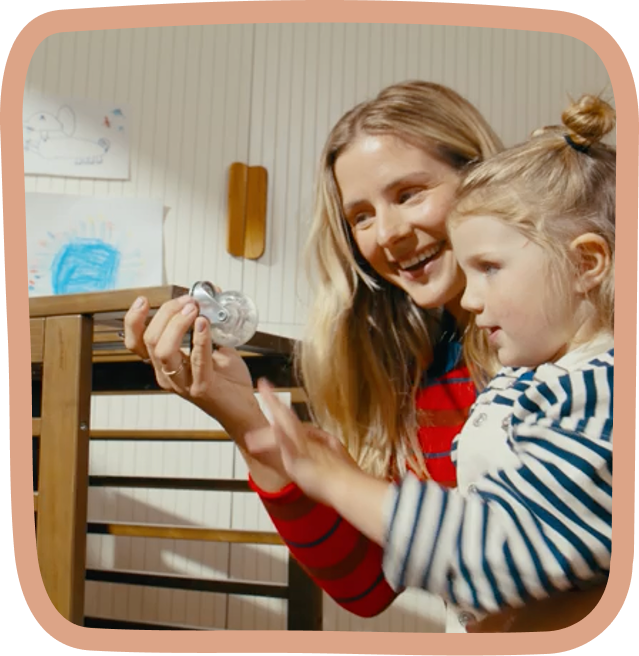 mom and daughter with crib