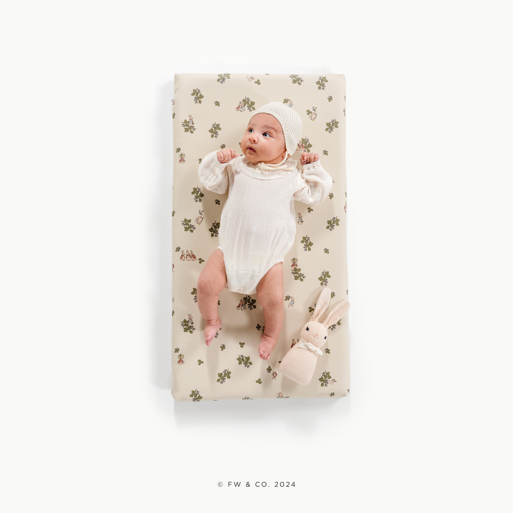 Image of a baby in padded mat