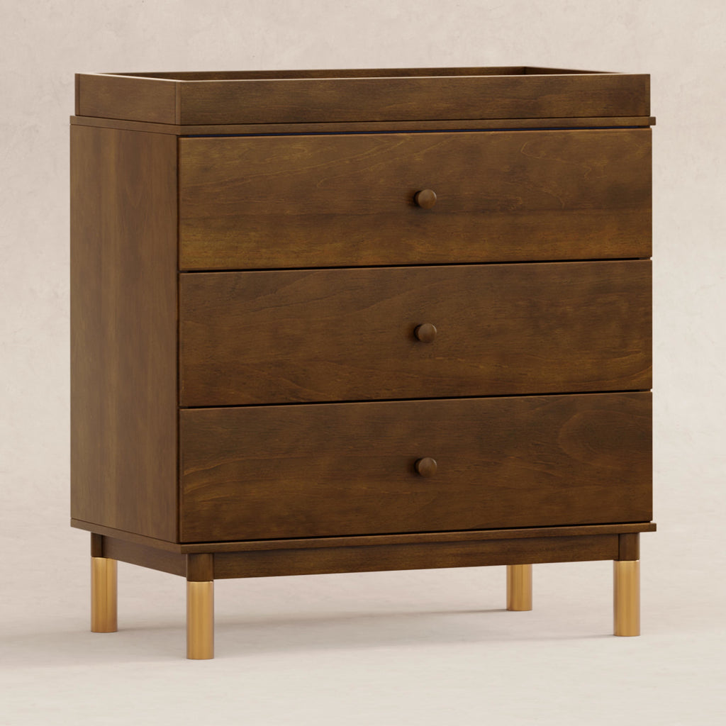 M12923NLGLD,Babyletto,Gelato 3-Drawer Changer Dresser  Gold Feet w/Removable Changing Tray in Natural Walnut