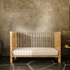 NW26101CKBU,Nursery Works,Altair Crib in Clear Acrylic with Burl