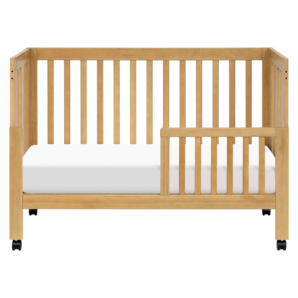 M6601HY,Babyletto,Maki Full-Size Folding Crib w/ Toddler Bed Conversion Kit in Honey